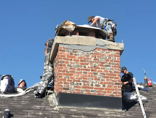 Dublin Chimney Sweep installing a custom chimney crown in Dublin, OH