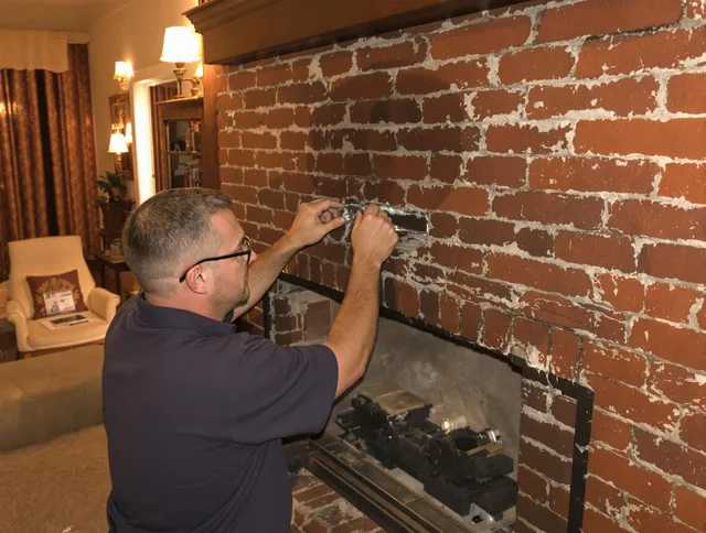 Dublin Chimney Sweep expert fixing a fireplace in Dublin, OH